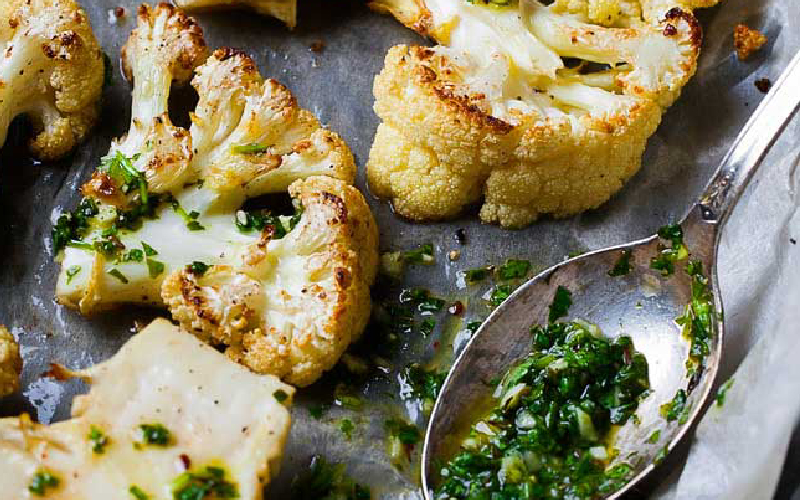 Roasted Cauliflower with Arugula Walnut Pesto